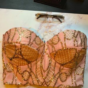 Pink and gold corset top.